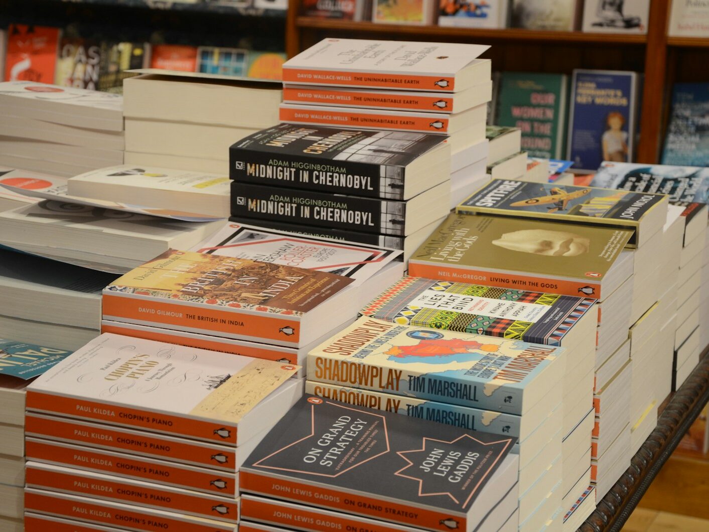 stack of books on white table